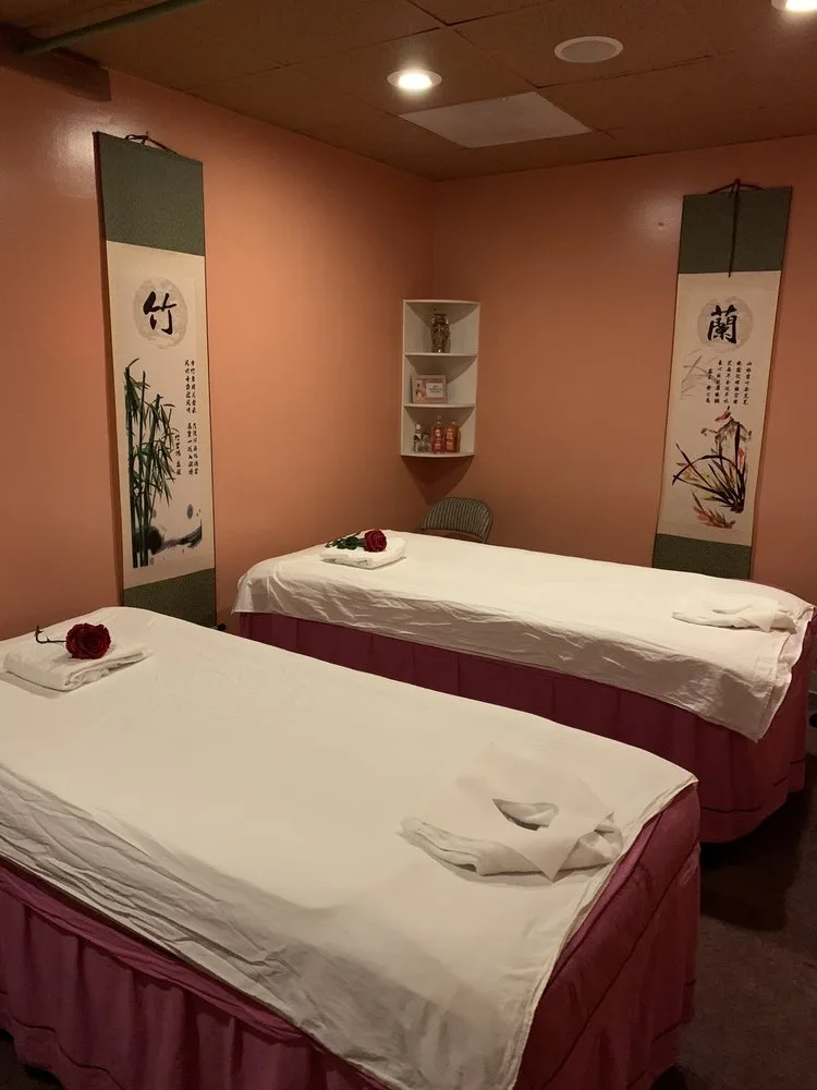 Couples massage room with twin tables and Asian scrolls